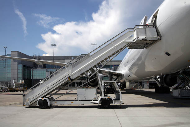 istock Airliner with boarding stairs 867806778