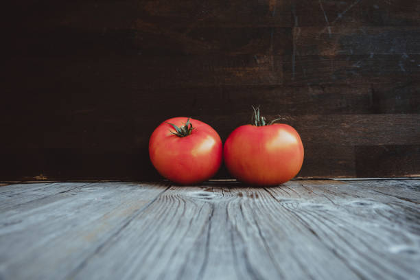 istock Tomatoes, on the old wooden table 867806798