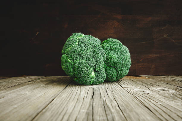 istock Fresh broccoli on the wooden table 867807250