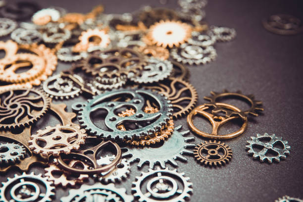 istock Assorted metal gears on gray background 867817070