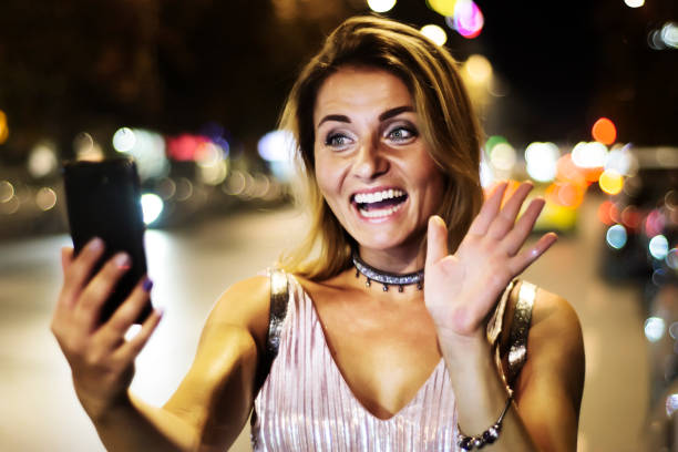 istock Pretty young woman using her phone 867824084