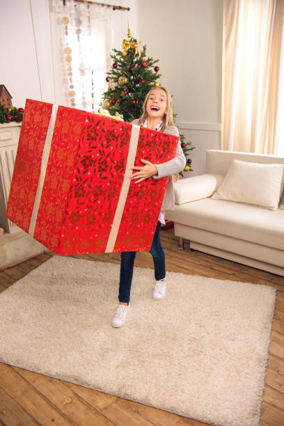 istock happy child with christmas gift 867836404