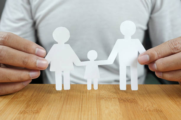 istock Man hands holding white paper family 867839522