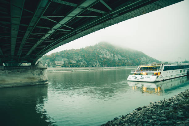 river in morning fog boat on the river mount in fog