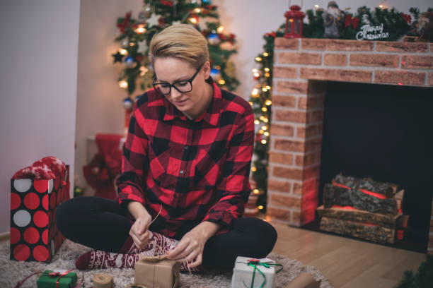 istock Young woman during preparations for Christmas at home 867845880