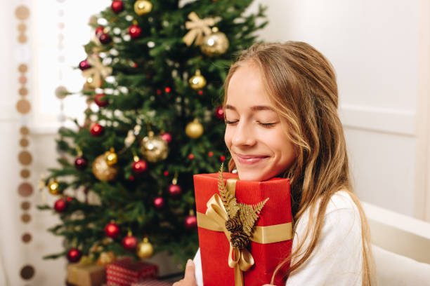 istock teenager with christmas present 867848194