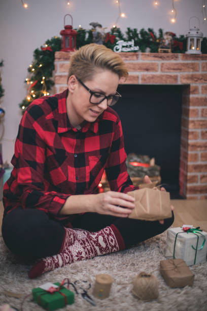 istock Young woman during preparations for Christmas at home 867849152
