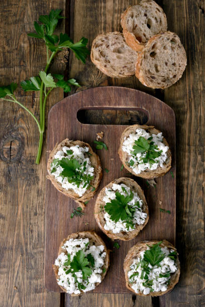 istock Sandwiches with curd cheese and green herbs 867852138
