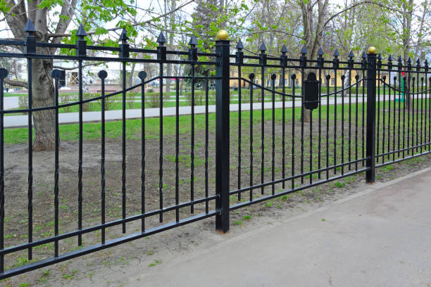 istock Black metal fence 867852804