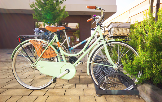 Parking bicycle in town at a bicycle rack in a concept of eco-friendly transport and healthy active lifestyle, Place for bicycles parking in outdoors.