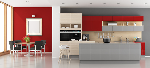 Red and gray modern kitchen with dining room - 3d rendering\n