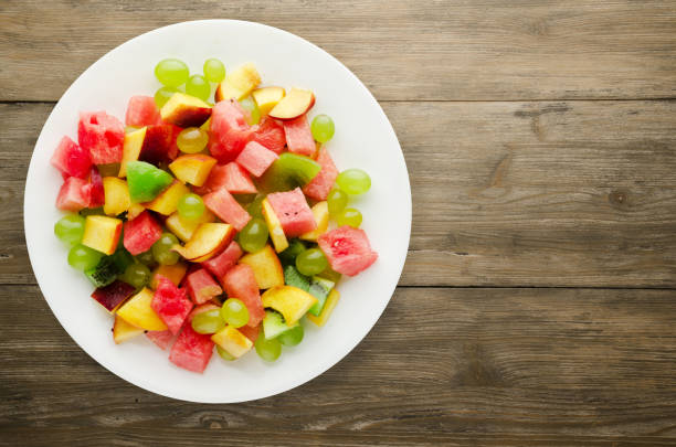 istock Vegetarian salad of fruit on a plate 867858758