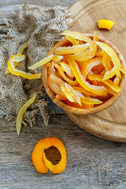 istock Bowl with homemade candied citrus and old sacking. 867862848