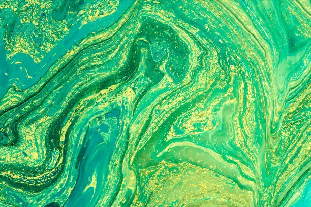 Photo of Blue marbling texture. Creative background with abstract oil painted waves handmade surface. Liquid paint.