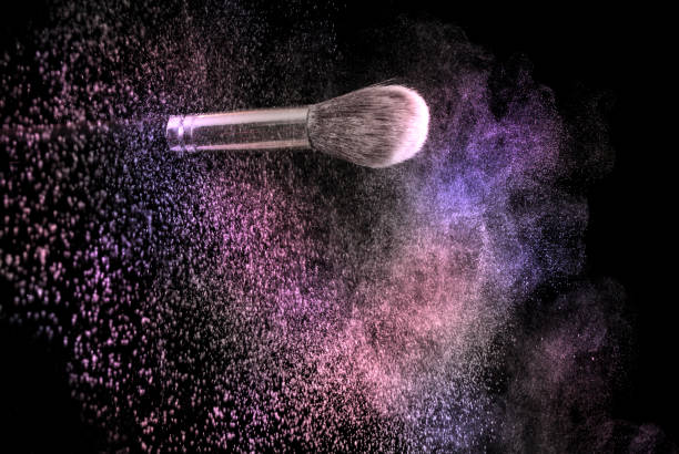 istock Make up powder explosion and brush, colorful dust 867872758