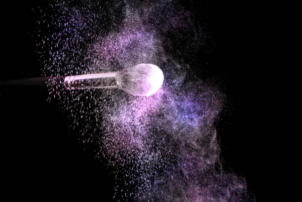 istock Make up brush and powder explosion dust in purple and pink color 867872802