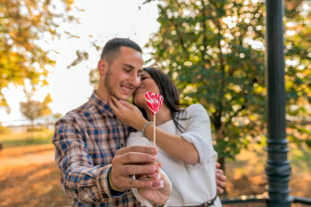 istock Couple with lollypop 867875898