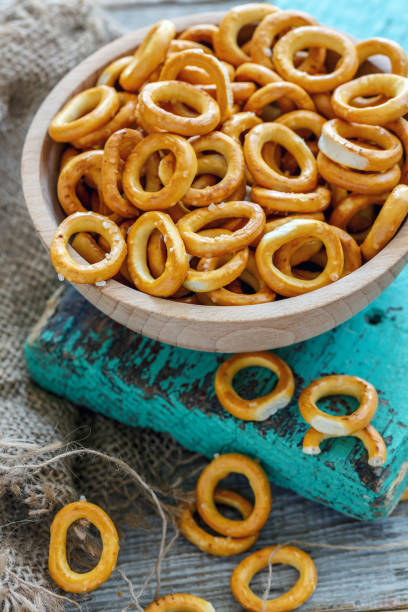 istock Bagels and salt in a bowl and old sacking. 867882568