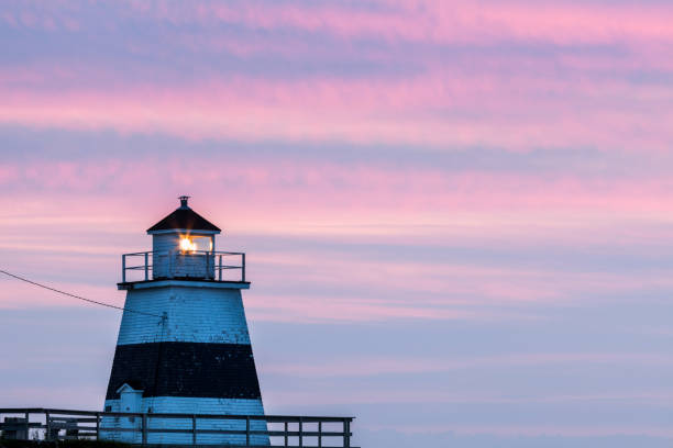 istock Margaretsville Lighthouse at sunset 867886692