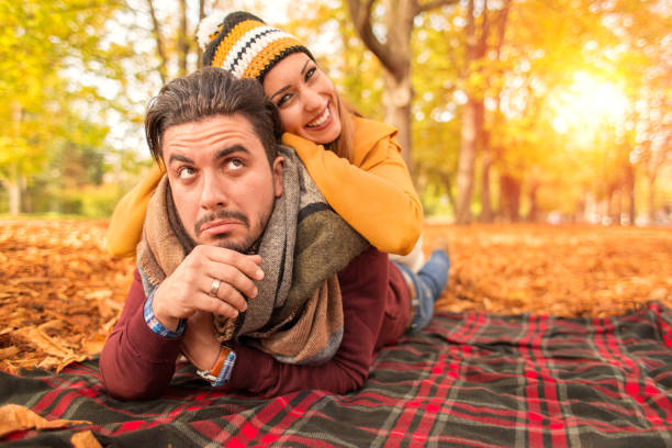 istock Happy couple at a park in autumn 867888468