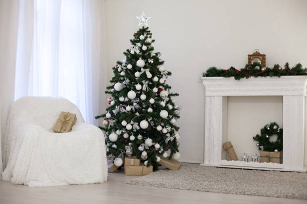 istock Christmas tree in a white room with Gifts Christmas Decor 867903826