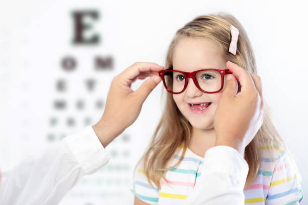 istock Child at eye sight test. Kid at optitian. Eyewear for kids. 867906434