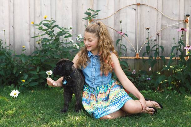istock Little Girl with Puppy 867909798