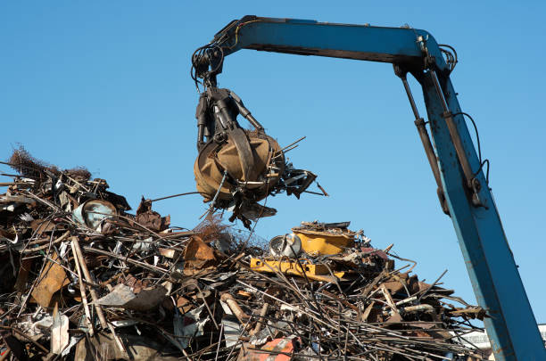 istock Scrap metal trash for recycling. Claw Grabber Crane 867916410