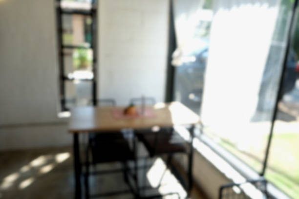 istock Coffee shop blur background with bokeh light with vintage filter 867918590