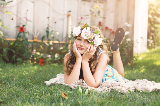 A beautiful girl, ten years old, wearing a floral crown.