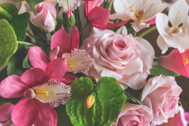 istock Decorative sweet food flowers from mastic or sugar on cake 867919294
