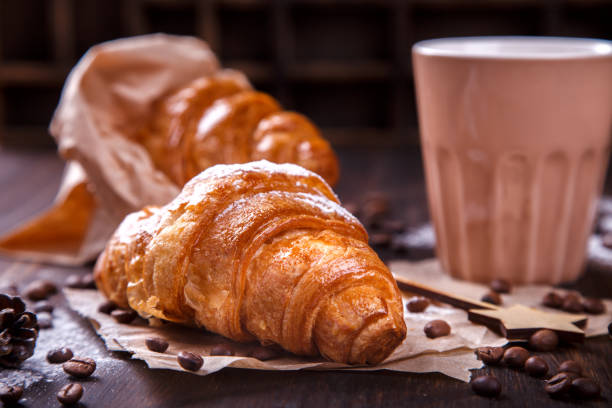 istock Christmas or New Year pastries,Croissant with a warming drink,coffee. 867921648