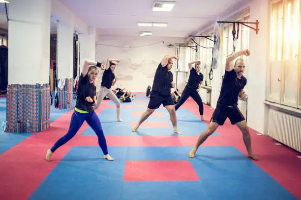 A group is doing self - defence exercises