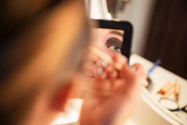istock Close-up on young woman's eye with heavy makeup 867925026