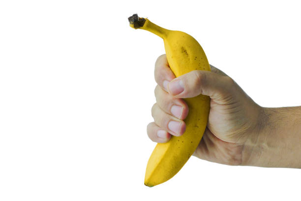 istock Hand holding banana isolated 867925466