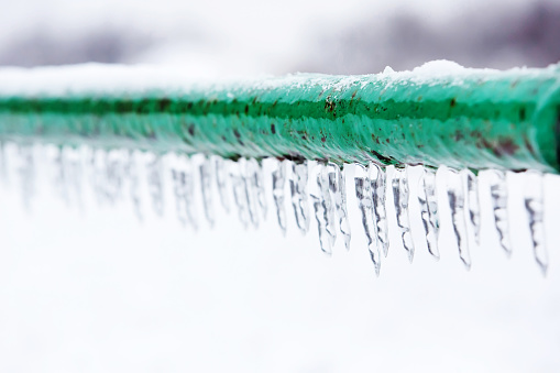 Snow on fence. Winter background. Copyspace. Weather. Climate