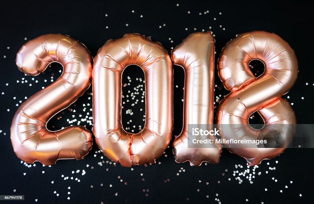 Happy 2018 gold New Year Balloons Happy 2018 gold New Year Balloons with glitter stars on black background. 2018 Stock Photo