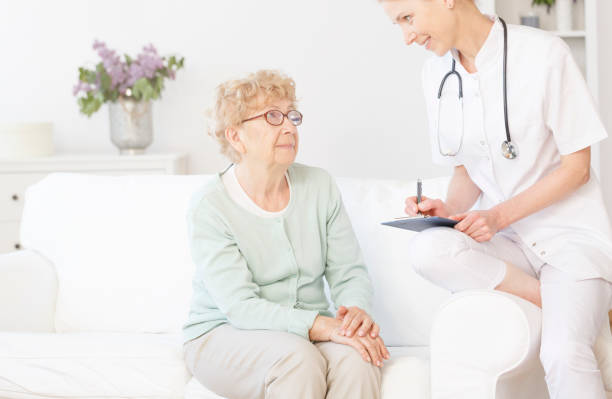 istock Doctor smiling to elderly patient 867944758