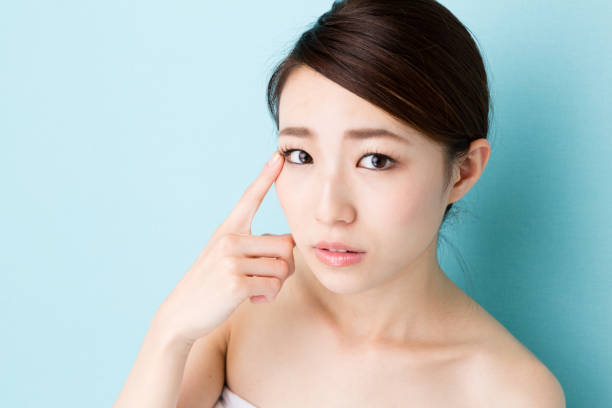 istock attractive asian woman beauty image isolated on blue background 867956072