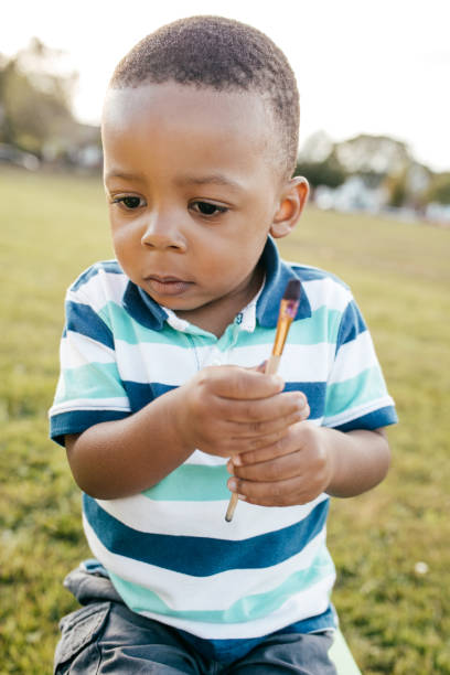 istock Adorable child with paintbrush 867957038