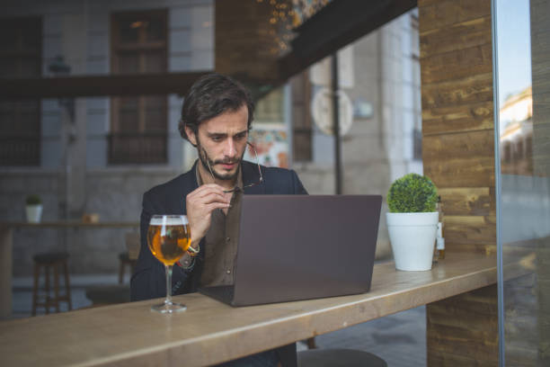 istock Man working on laptop in cafe 867959566