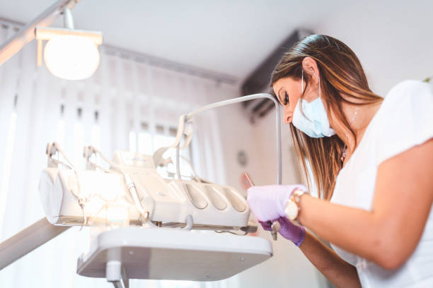 istock Close-up of young dentist working with tools at the office 867960238