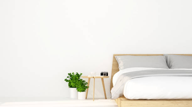 istock white bed room in hotel or apartment for artwork - Interior design - 3D Rendering 867968842