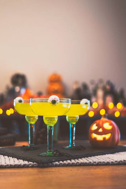istock Halloween time. Vibrant green cocktail with floating eyeballs 867978846