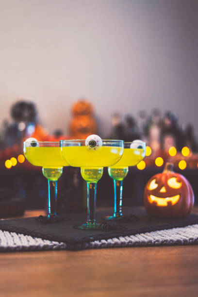 istock Halloween time. Vibrant green cocktail with floating eyeballs 867978906