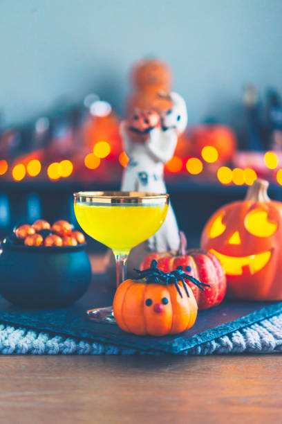 istock Halloween time. Vibrant colored drinks with cauldron of candy 867978926