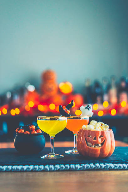 istock Halloween time. Vibrant colored drinks with cauldron of candy 867979214