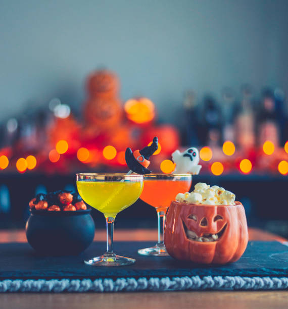 istock Halloween time. Vibrant colored drinks with cauldron of candy 867979230