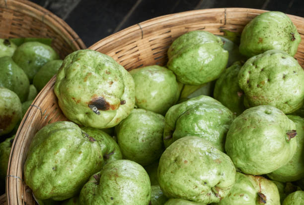 istock Fresh fruit, guavas, in a basket at supermarket. 867984762