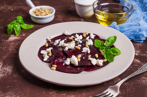 Beetroot salad with cheese and pine nuts. Selective focus.
